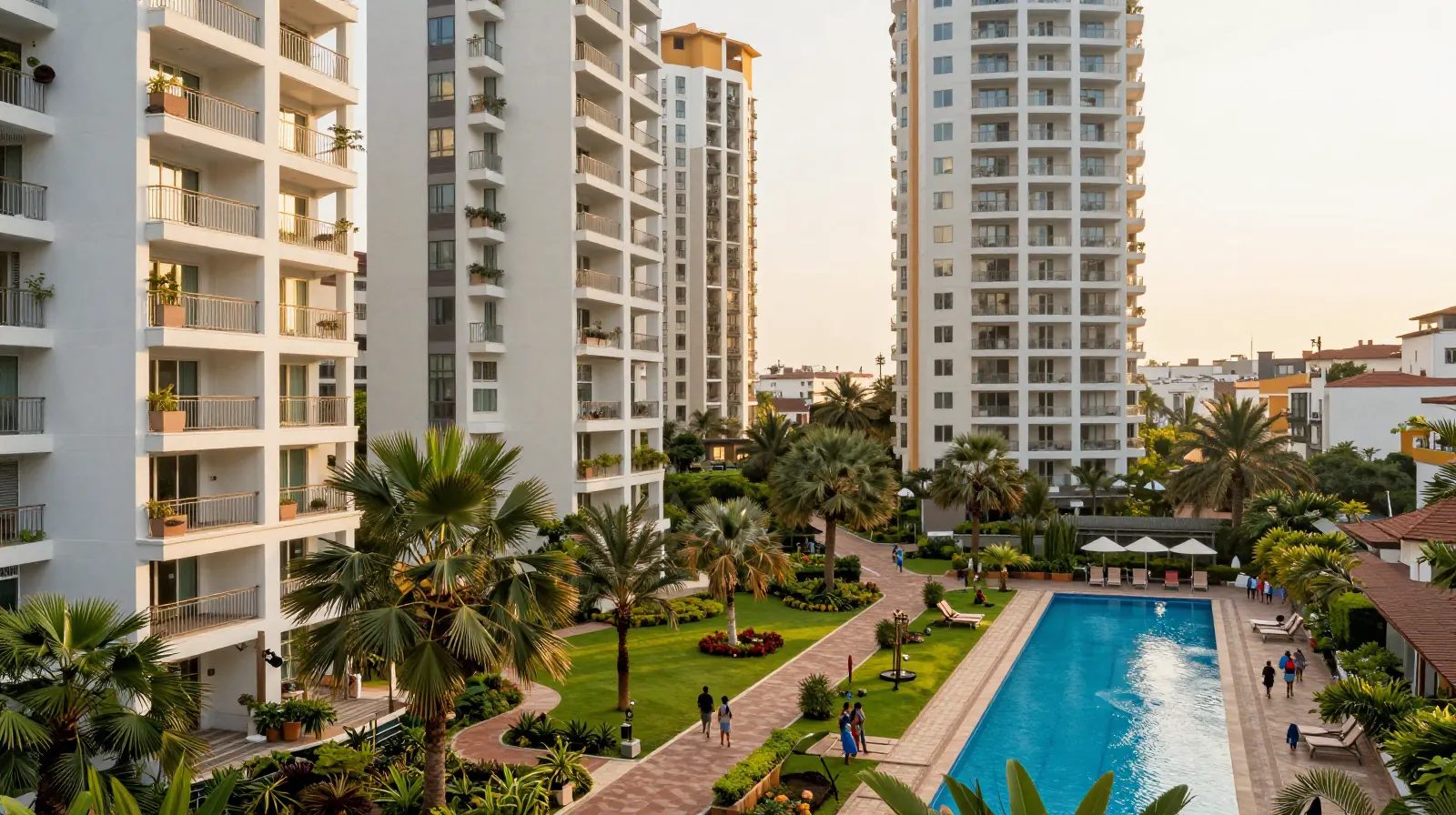 Gated community of apartment towers around a landscaped garden and pool